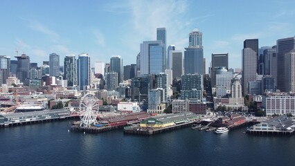 Aerial View of Modern City Skyline and Waterfront Ferris Wheel