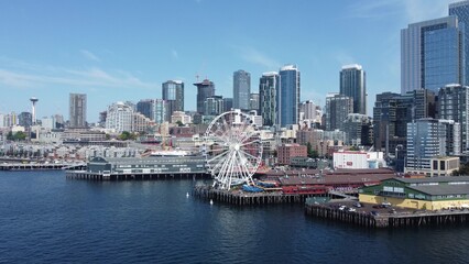 Scenic Waterfront With Seattle Skyline and Iconic Ferris Wheel Under Clear Blue Sky
