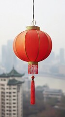 Obraz premium Close-Up of a Traditional Red Lantern Hanging Outdoors, Symbolizing Chinese New Year, Cultural Heritage, and Festive Celebrations in Urban Setting. Vertical