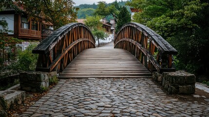 Wooden bridge in an old village, connecting two sides a quiet cobblestone street