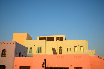 Colorful houses in the old port area of ​​Doha, Qatar in sunny day