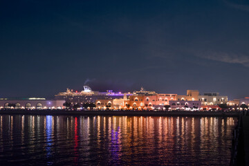 Colorful houses at night in the Old Port area of ​​Doha, Qatar