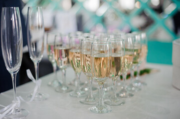 Celebration of Elegance: A Toast with Sparkling Champagne Glasses at a Festive Gathering