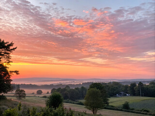sunset in the mountains. sunset, sky, sun, clouds, sunrise, orange, evening, nature, landscape, cloud, red, dusk, light, yellow, color, blue, tree, view, silhouette, morning, night, trees, countryside