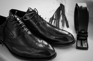 Elegant Black Dress Shoes with Accessories in Monochrome Style