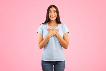 Thank You. Impressed Young Woman Keeping And Pressing Hands To Her Chest Expressing Gratitude, Touched By Compliment Posing Over Yellow Studio Background. Appreciation Concept - obrazy, fototapety, plakaty