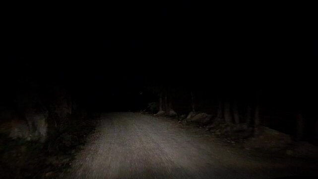 Driving dark road at night