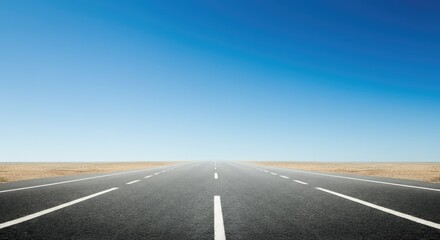Fototapeta premium Empty straight road leading into horizon, with vast desert and clear blue sky