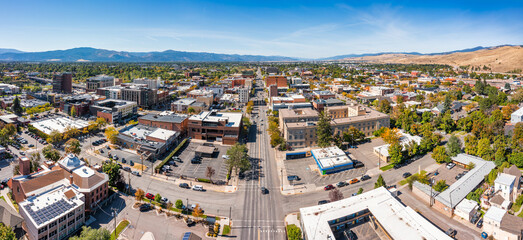 Aerial panorama of Missoula, Montana, along Broadway street. Missoula is a city in and the county seat of Missoula County, Montana. It is located along the Clark Fork River.