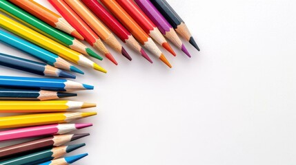 Fototapeta premium Vibrant colored pencils neatly arranged on a white background, inviting creativity and inspiration in every stroke.