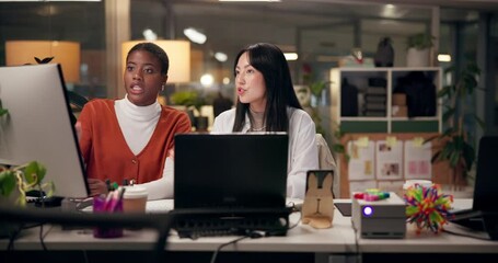 Advice, computer and web design with business women in office at night for project management. Collaboration, creative and discussion with website developer people in workplace for programming