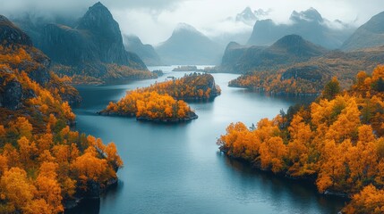 Misty autumn lake surrounded by colorful foliage and mountains.