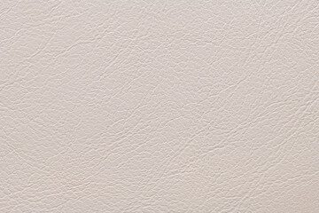 Cream-colored textured surface with fine, intricate lines and subtle variations in shading, resembling leather, providing a soft, elegant appearance