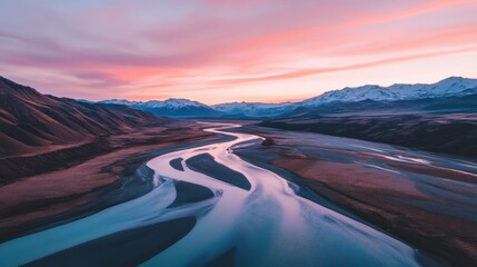 Fototapeta premium Serene View of Winding River Under Colorful Sunrise Sky