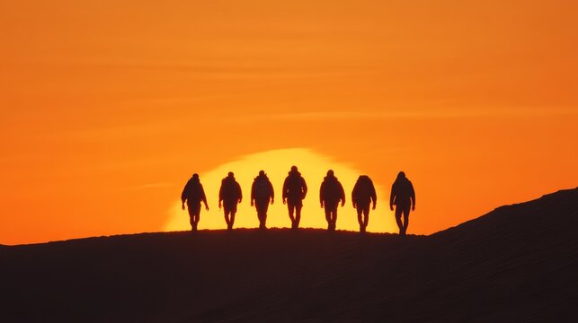 Silhouetted Figures Walking Towards a Vibrant Sunset on a Horizon, Creating a Striking Contrast Against a Warm Sky and Evoking Adventure and Journey