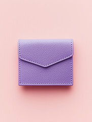 Compact Purple Wallet on Pale Pink Background: Chic Simplicity