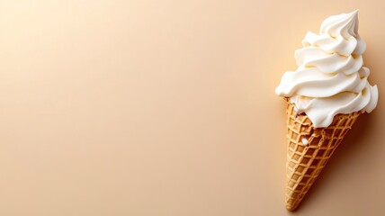 Vanilla soft serve ice cream in waffle cone on beige background