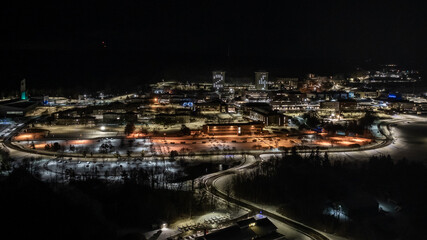 Ithaca, NY, USA - 12-21-2024:  Aerial image of Ithaca College's yearly tradition of lighting the East and West residential towers with last two numbers of the year.