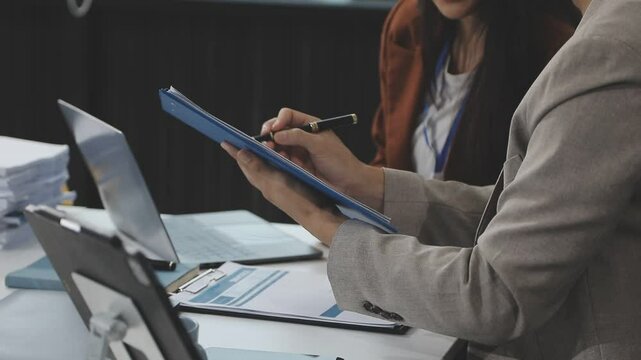 Business Documents, Auditor businesswoman checking searching document legal prepare paperwork or report for analysis TAX time,accountant Documents data contract partner deal in workplace office