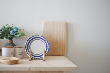 Minimalist Table Display with Blue Striped Plate and Wooden Elements