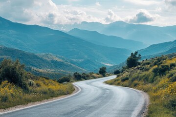 Fototapeta premium Winding asphalt road through scenic mountain landscape.