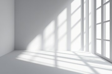 Obraz premium Sunlight streams into a minimalist white room, illuminating the floor and wall with shadows.