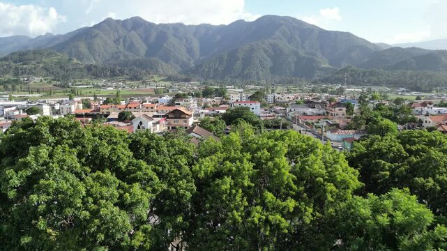 Aerial view of the town center of Constanza with central park and church in the mountainous Central Range of the Dominican Republic