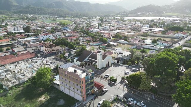 Aerial view of the town center of Constanza in the green Central Range of the Dominican Republic during sunset