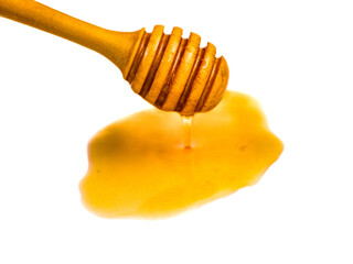 Natural honey dripping from dipper on white background