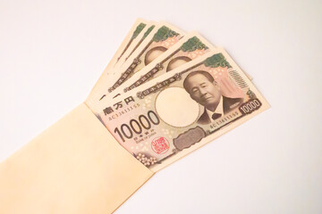 封筒に入った新札の一万円札の写真素材