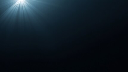 Obraz premium Bright light rays emanating from top left corner on dark background.