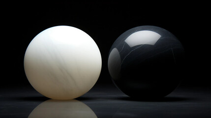 Two marble spheres on black surface