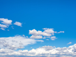 Beautiful scene of white cloud on clear blue sky background, horizontal style. Cloudy fluffy clouds floating scattered and blowing with the nature wind on the horizon sky.