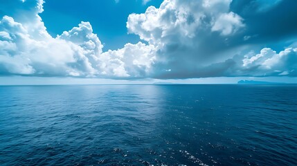 Obraz premium Serene Blue Ocean with Cloudy Sky Reflection