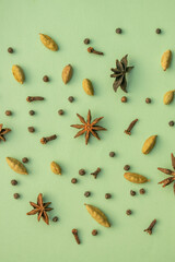 Star anise, cloves,Cardamom, spices for making herbal and winter drink decorated of colour background 