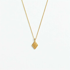 gold necklace with diamond pendant on white background