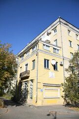 Architecture of old Soviet Union houses in Stalin's Empire style. Exterior of the facade of a vintage residential building in Russia
