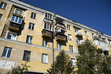 Naklejka premium Architecture of old Soviet Union houses in Stalin's Empire style. Exterior of the facade of a vintage residential building in Russia