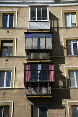 Architecture of old Soviet Union houses in Stalin's Empire style. Exterior of the facade of a vintage residential building in Russia
