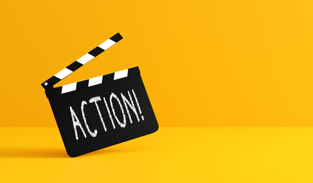 Movie clapperboard showing action text on yellow background