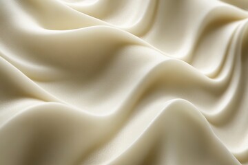 Obraz premium close-up of smooth cream texture forming organic waves with faint shadows under soft natural light