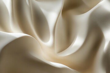 Obraz premium close-up of smooth cream texture forming organic waves with faint shadows under soft natural light