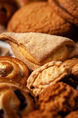 Assorted baked goods displayed on a wooden table, showcasing various textures and shapes