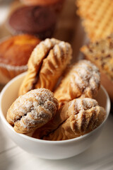Tasty homemade pastries arranged in a bowl, ideal for dessert lovers and special occasions