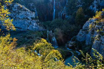 Waterfall in the Plitvice Lakes in Croatia. The waterfalls in forest. Summer view of beautiful waterfalls and clear lake. Plitvice Lakes National Park, Croatia. Summer nature landscape.