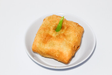 Martabak is a popular Indonesian street food. Martabak are fried pancakes or crepes and are usually filled with beaten eggs, chopped spring onions, carrots, potatoes and minced meat.