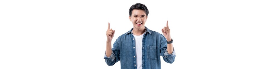 A man in a blue shirt is pointing at the camera with his hands raised