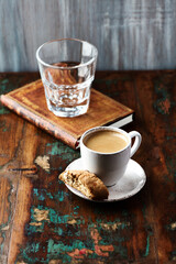 Cup of coffee on wooden background. Close up	