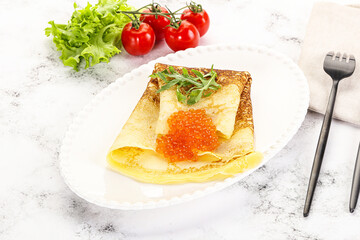 Russian pancake with red caviar