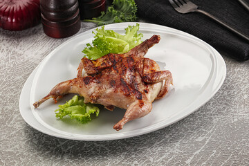 Grilled quail in the plate